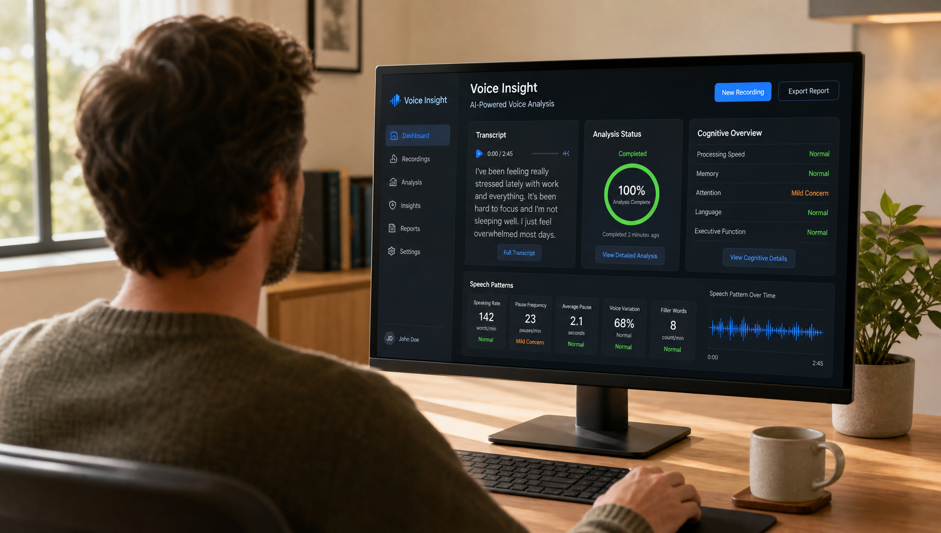 Voice Insight dashboard on a desktop monitor with an adult working at a desk